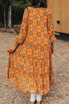 Frill printed tie neck long sleeve dress in orange, back view