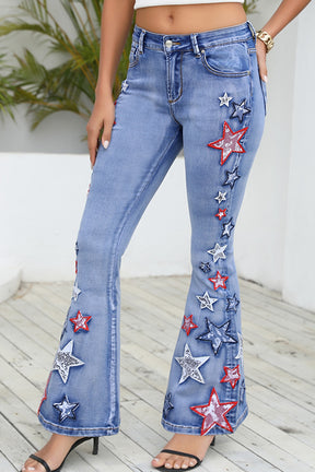 Front view of star applique wide leg jeans