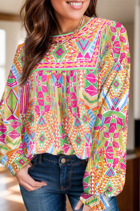 Front view of geometric printed round neck long sleeve blouse.