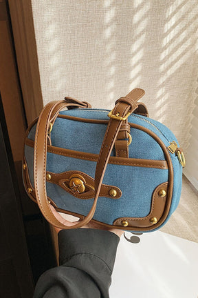 Blue suede studded shoulder bag with brown accents