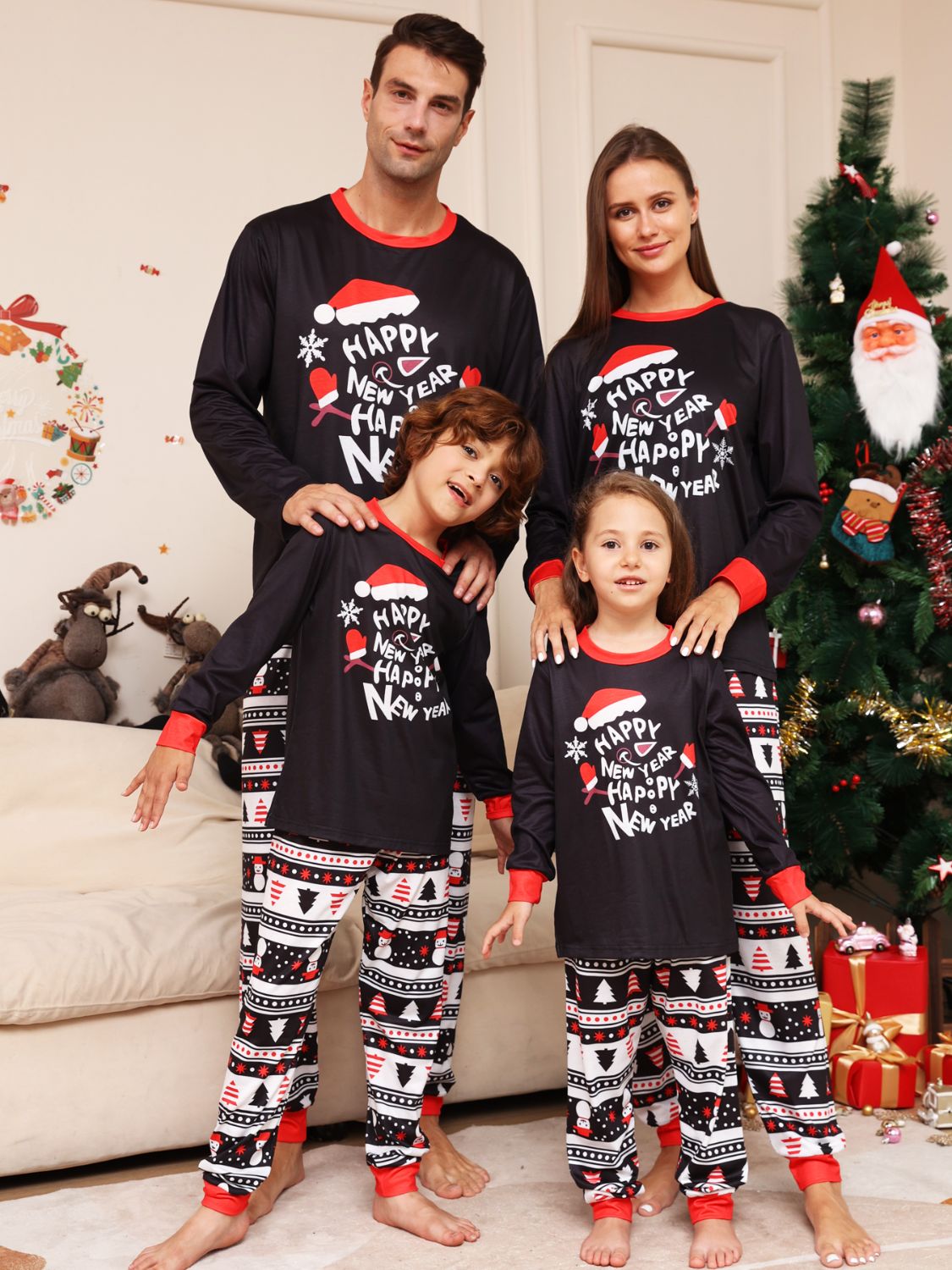 Family wearing matching festive graphic top and pants sets