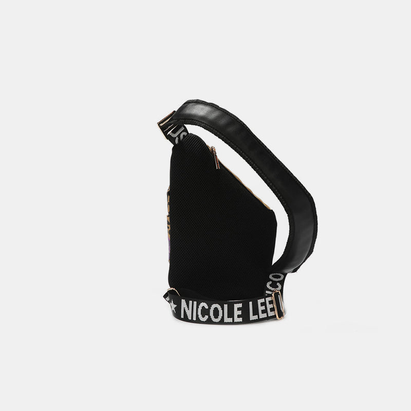 Side view of Nicole Lee USA crossbody bag with logo strap